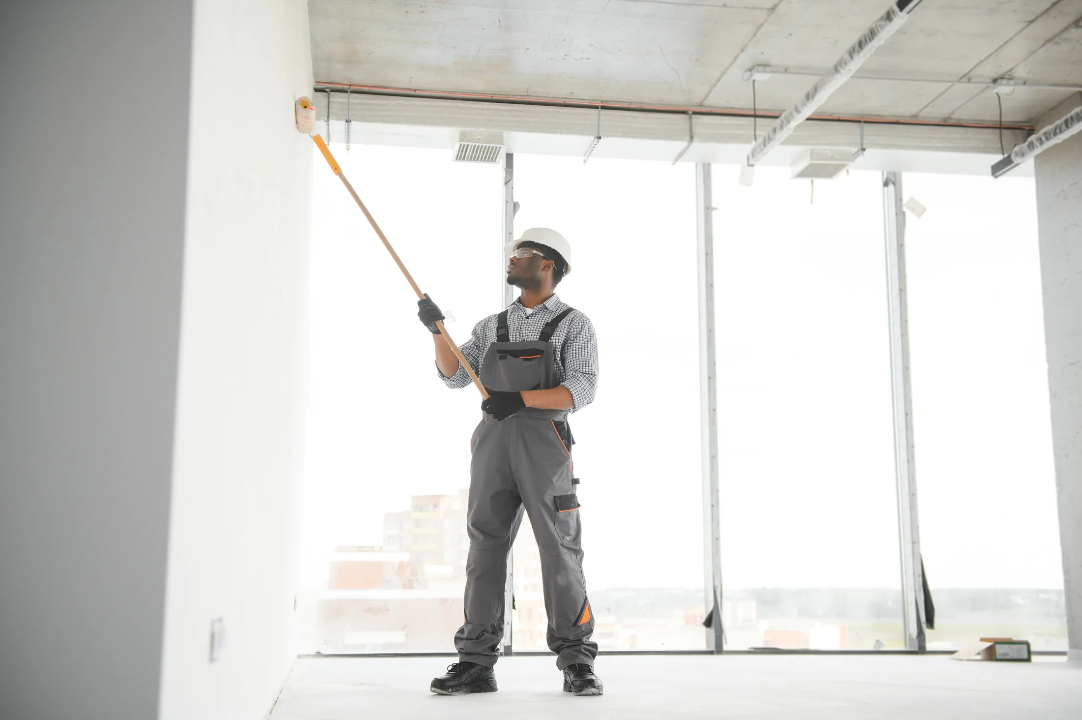 Contractor finishing a bright commercial interior